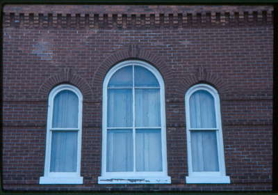 The Village Shop, 67 Main Street East, Huntsville, Ontario, 1980-1990, upper windows.