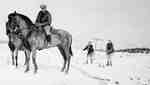 Skijoring behind horses, Huntsville, Ontario, 1930s.