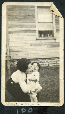 Unidentified Woman Embracing a Young Child