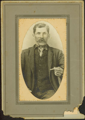 Portrait of a Man Holding a Cigar