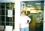 Susan Hoffman standing in the doorway of the Grace Schmidt Room of Local History