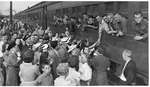 World War II: Unidentified group of well wishers and soldiers at train station, London, Ontario