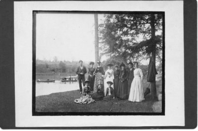 Unidentified group of men and women beside the Thames River, London, Ontario