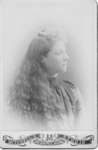 Portrait of an unidentified woman with long wavy hair