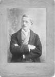Portrait of an unidentified man with arms crossed, Strathroy, Ontario