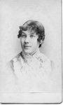 Portrait of an unidentified young woman with short curls around her face.