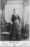 Portrait of an unidentified woman wearing a dark coloured dress with a white high neck collar, London, Ontario