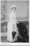 Portrait of an unidentified young woman dressed in a light coloured dress and hat, London, Ontario