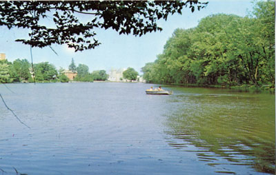 Mill Pond, Milton, Ontario with view of town, and some recreational boaters.