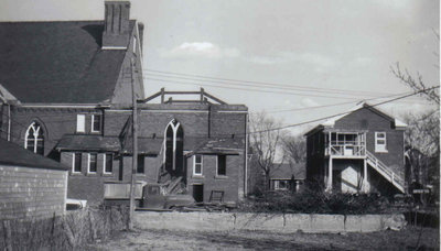 Back view of the Sunday School and the P. L. Robertson house