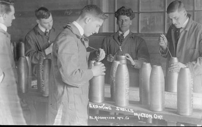 Examining shells at the P. L. Robertson Mnfg. Co.