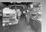 Jack Hannant Sr. (right) at his grocery store.