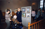New Year's Levee.  1997.   Marie Clements admiring pictures at the Art Show.