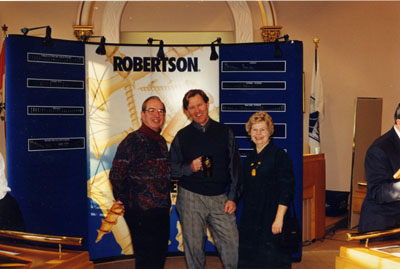 New Year's Levee, 1999.   Walt Elliott, Rick Day, Anne Elliott at the P. L. Robertson display