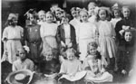 Large group of little girls in summer outfits