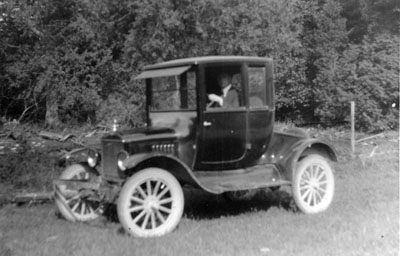 Man sitting in automobile.