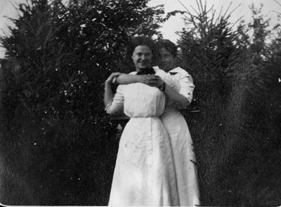 Two women in white dresses