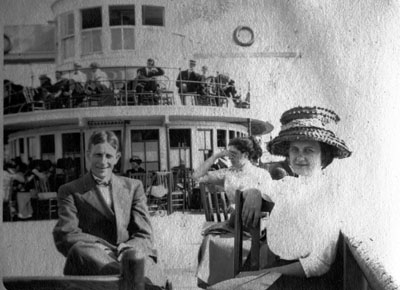 Man and woman seated on deck