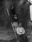 Three women posed on step ladder