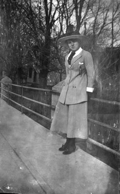 Young lady posed against rail