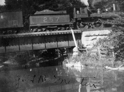 G.T.R. train crossing bridge at Mill Pond. Milton.