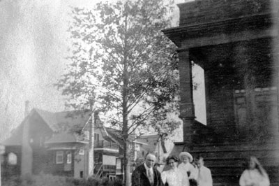 Group posed outside house