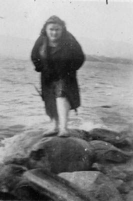 Young lady posed on lake shore