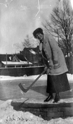 Ted (?).  Lady with ice hockey stick