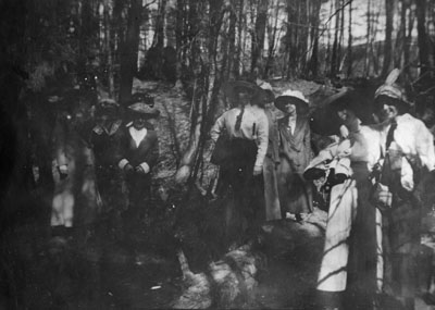 Group of women posed in wooded area