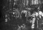 Group of women posed in wooded area