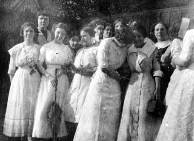 Group of women in white dresses