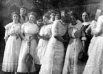 Group of women in white dresses