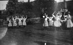 Group of young women dancing on lawn