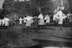 Women dancing on lawn