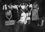 Group of women posed in theatrical performance