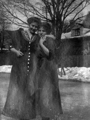 Two women posed in winter scene