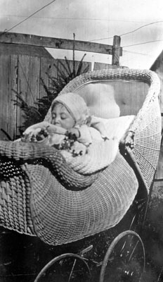 Baby in wicker carriage