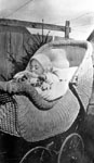 Baby in wicker carriage