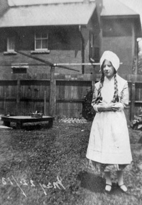 Adolescent girl in white dress