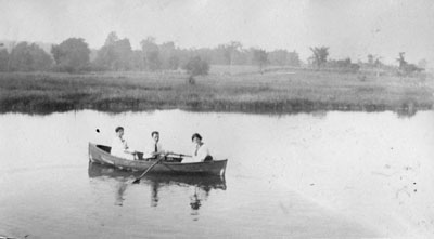 Two women and a man in rowing boat