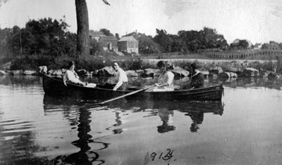 Four women rowing boat