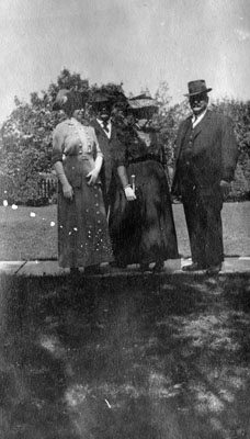 Two men and two women posed in garden