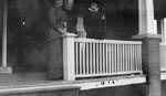 Three women standing on porch