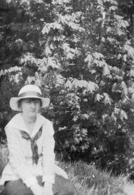 Young lady seated on grass