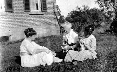 Three women with pets