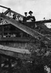 Group standing on wooden construction