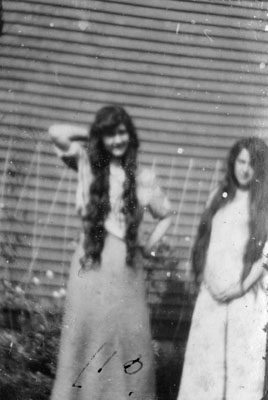 Two young ladies with long hair