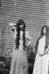 Two young ladies with long hair