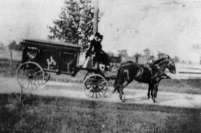 Hearse drawn by horses. Clarence Turner - Undertaker.   Horses Net and Nel.