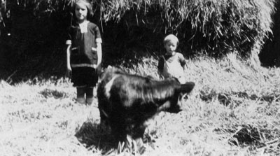 Margaret and Murray McKie in barnyard at &quot;Rose Hill&quot; Farm.